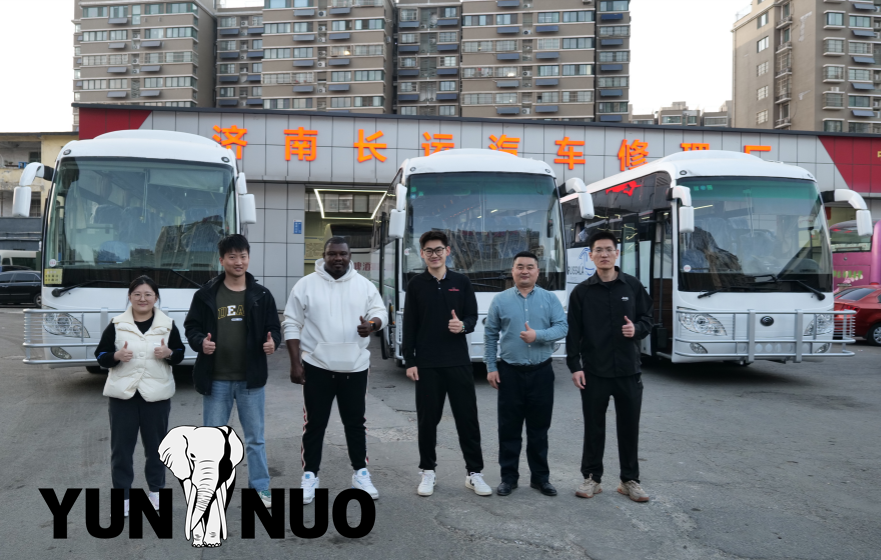 The clients from Chad come to inspect the four buses they have purchased.